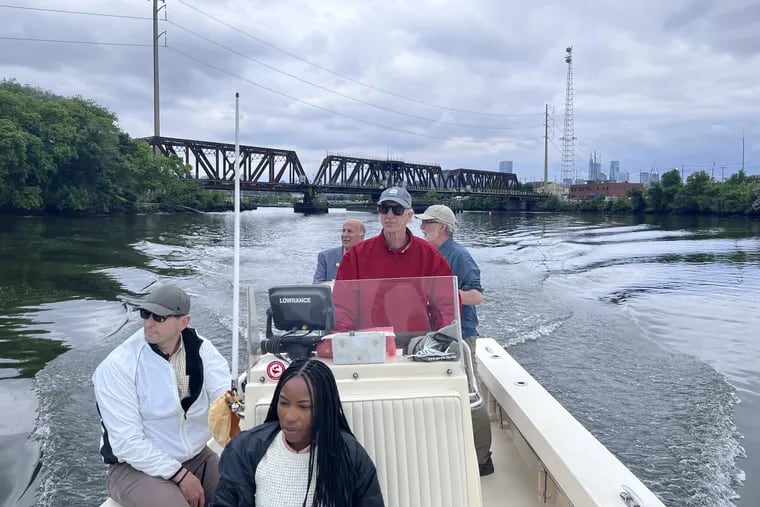 Kianna Bingham of Councimember Jamie Gauthier's office (front); Nathan Boon, of the William Penn Foundation (left front); Dave Corddry at the helm; Philadelphia Councilmember Mark Squilla (rear left); and, Nick Pagon of Riverways Collaborative (rear, right) on boat tour of the Schuylkill.